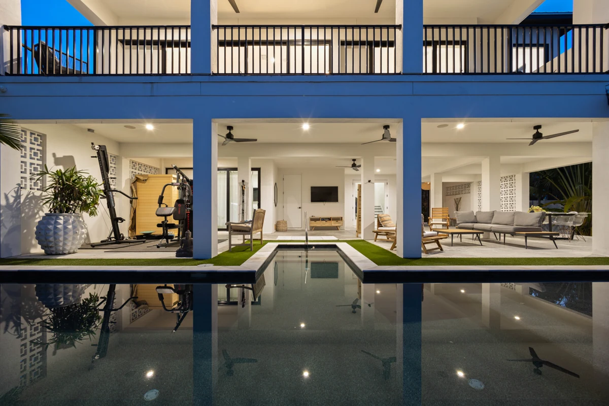 Modern poolside home at blue hour